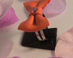 Bague noeud en cuir corail r&eacute;glable